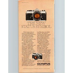 1977 Olympus OM-1 SLR 35mm Film Camera Vintage Print Ad The New Status Symbol